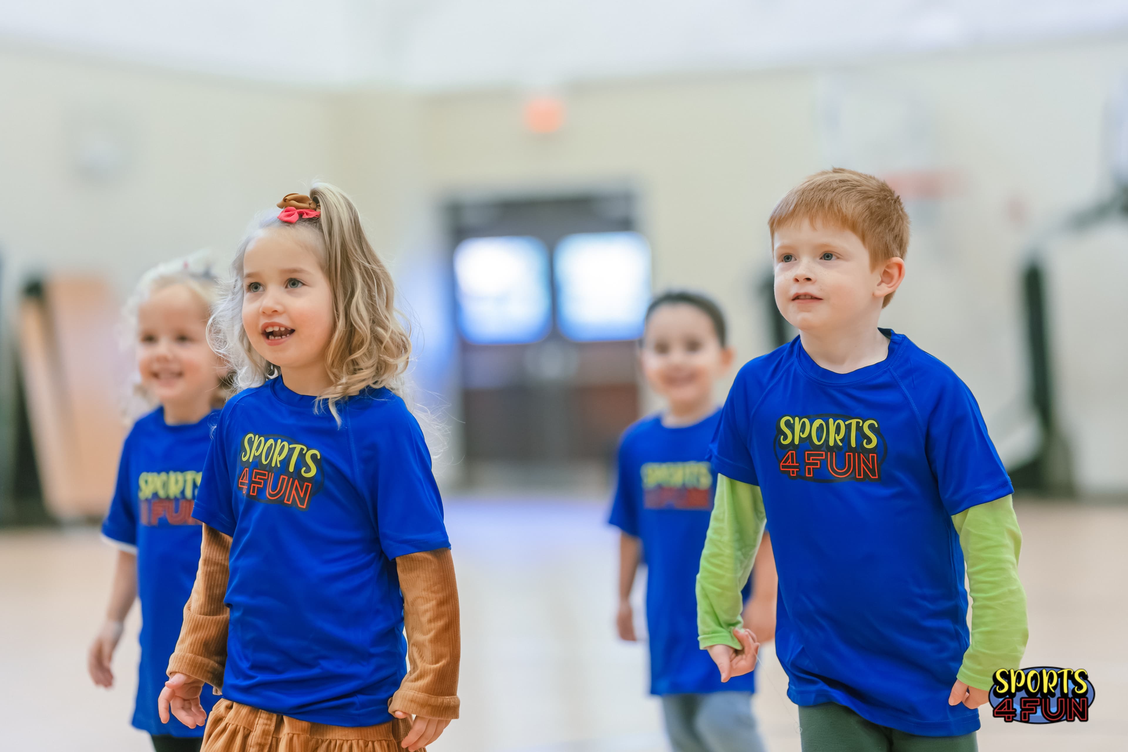 Children in Sports4Fun shirts in an indoor sports session